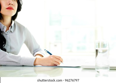 Business Woman Taking Notes At Seminar