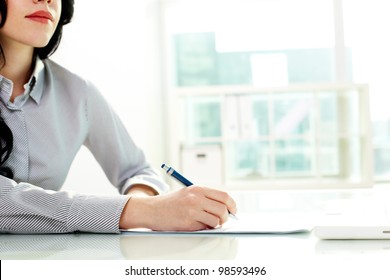 Business Woman Taking Notes At Seminar