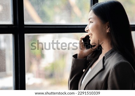 Business woman talking on the phone, young Asian women as executives, founding and running start-up executives, young female business leaders. Startup business concept.