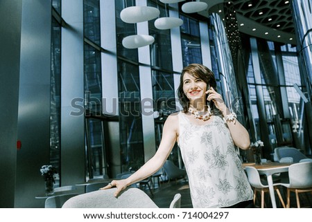 Business woman talking on the phone in the office.
Business conversation via phone. Call. Mobile Communication