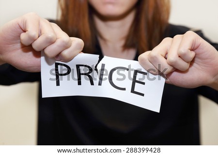 business woman tearing price banner