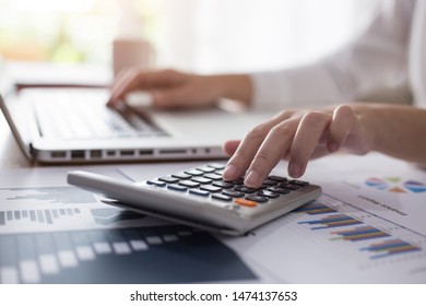 Business Woman Thinking Account, Using Calculator And Laptop On Desk 