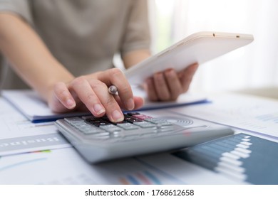 Business Woman Thinking Account, Using Calculator And Laptop On Desk 