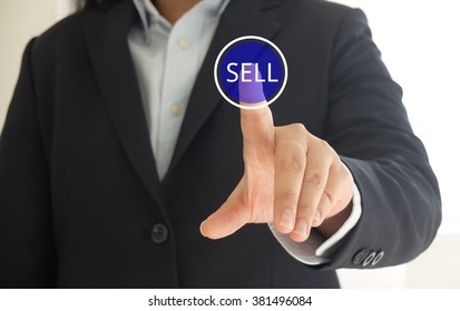 Business Woman Touching Sell Button