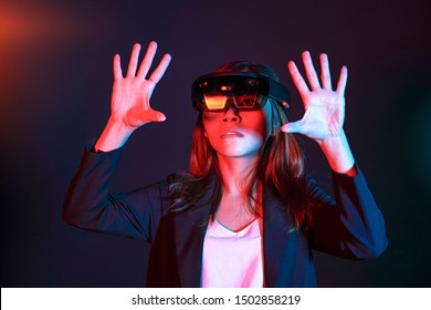 Business woman try vr glasses hololens in the lab. Mixed reality future technology concept.