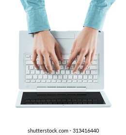 Business Woman Typing On A Laptop Keyboard On White Background, Top View, Hands Close Up