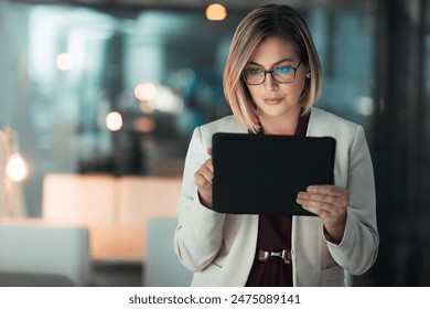 Business woman, typing and tablet in office for corporate communication, internet research and networking. Female person, technology and working late night for project planning and company email - Powered by Shutterstock