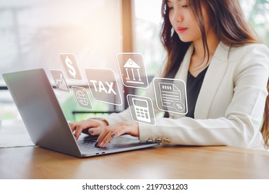 Business Woman Uses A Computer To Complete Online Personal Income Tax Forms, Calculating Tax Deductions, VAT, Income Taxes, Property Taxes.