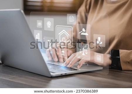 business woman uses a computer and house law icons on the dashboard screen to study or search law home, building, or estate and consult a lawyer online tax house