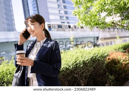 business woman uses smart phone