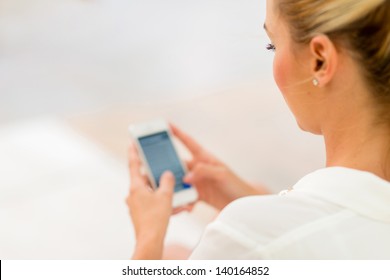 Business Woman Using App On A Smart Phone