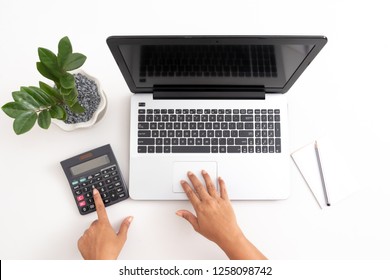 Business Woman Using Calculator And Laptop Computer On White Office Desk, Accounting Concept With Copy Space