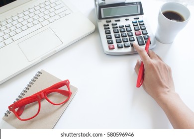 Business Woman Using Calculator And Laptop Computer On White Office Desk, Accounting Concept With Copy Space