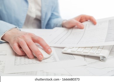 Business woman using computer mouse and keyboard at office