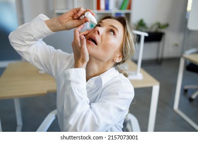 Business Woman Using Eye Drops