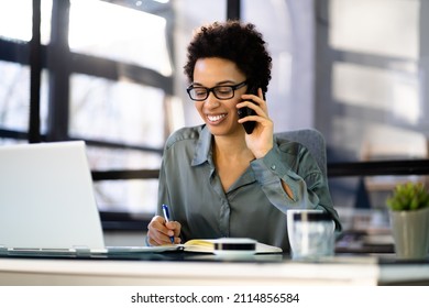 Business Woman Using Mobile Phone Technology And Laptop