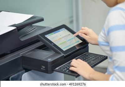 Business Woman Is Using The Printer To Scanning And Printing Document