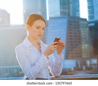 Business Woman Using Smartphone. Sun Beams, Lens Flare