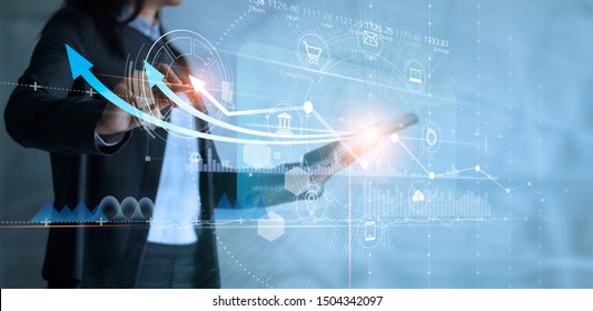 Business woman using tablet analyzing sales data   drawing growth graph and icon customer network connection virtual interface  Business strategy  Digital marketing  