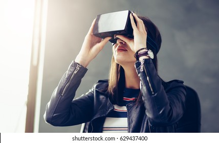 Business Woman Using Virtual Reality 3-D Glasses Headset At The Office