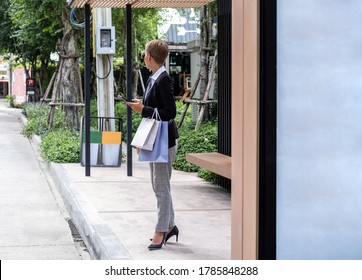 Business woman waiting for a bus stock photo