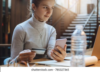Business woman waiting for confirmation of her online order while working in office - Shutterstock ID 785327365