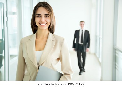 Business Woman Walking In The Office Corridor