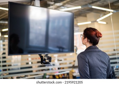 Business Woman Watching TV In Conference Room. 