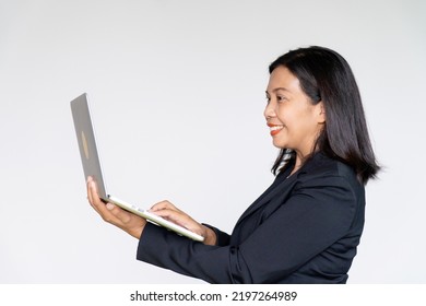 Business Woman Wearing Black Suit Jacket Holding And Looking On Her Laptop On White Background