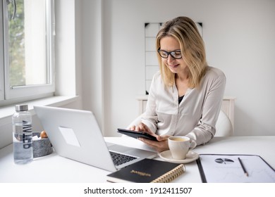 Business Woman Wearing Glasses Working On Laptop In Office