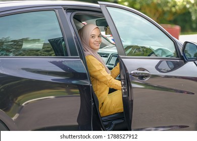 Business Woman Wearing Hijab On A Business Travel Closing Car Door