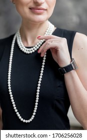 Business Woman Wearing Pearl Necklace