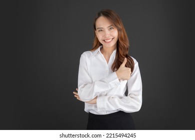 Business Woman Wearing White Shirt Standing And Doing Various Poses On A Black Background.