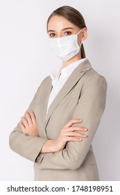 Business Woman Wears Light Brown Suit And  Mask Standing On White Background