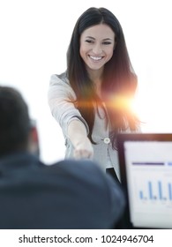 business woman welcomes colleague with handshake