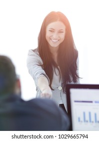 business woman welcomes colleague with handshake