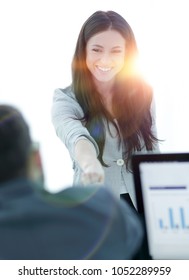 business woman welcomes colleague with handshake