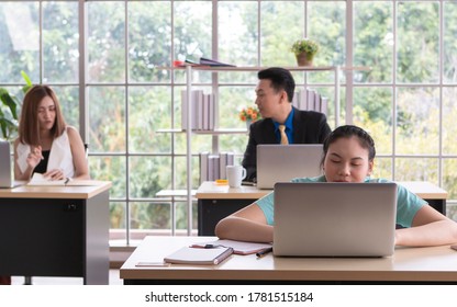 Business Woman in wheelchair at the desk in her office. Coworker on wheelchair using computer in meeting room. Young woman in wheelchair working in the office, working disabled concept. - Powered by Shutterstock