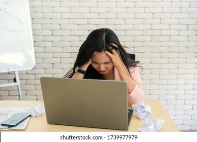 business woman work from home suffering stress and feel tired after working on tablet computer, Lifestyle woman relax after working at home concept. depressed businesswoman.