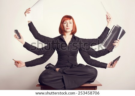 Business woman at work in the office. A master of many things. Have time to do much. 