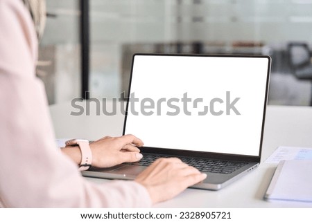 Business woman worker or student elearning looking at white mock up blank screen using laptop computer learning online, remote working, searching on web. Website mockup display template. Over shoulder