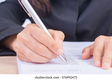 Business woman working with documents in the office - Shutterstock ID 376992475