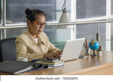 Business woman working with laptop at business office. Selective focus. - Shutterstock ID 760326091