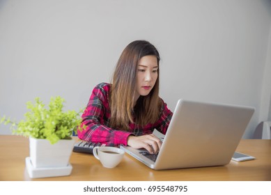 Business woman working at office with laptop and documents on his desk - Shutterstock ID 695548795