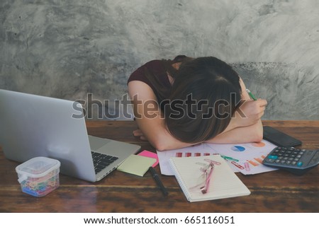 business woman working on computer. ,female secretary look like serious and stressed with her job slumped down on the table
