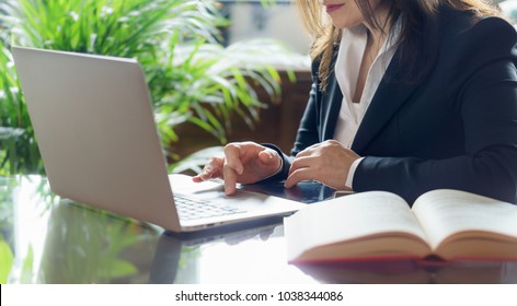 Business Woman Working On A Laptop. Business, Legal Law, Advice And Justice Concept. Selective Focus.