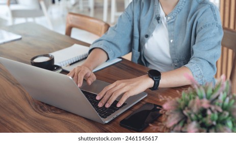 Business woman working on laptop computer, surfing internet at coffee shop. Casual business woman, freelancer online working, searching the information on laptop. Student studying online, e-learning - Powered by Shutterstock