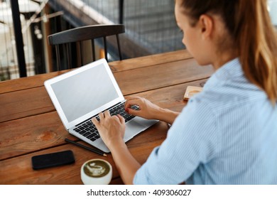 Business Woman Working On Laptop, Using Computer At Cafe Table. Closeup Of Beautiful Female Freelancer Typing On Notebook Keyboard. - Shutterstock ID 409306027