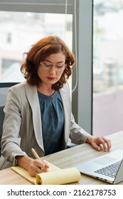 Business Woman Working On Plan Of Presentation For Upcoming Meeting With Investors