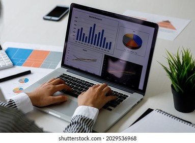 Business woman working on project for analyzing company financial report balance statement with documents graphics at modern office. business,economy, market,money and tax concept . - Shutterstock ID 2029536968
